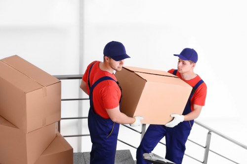 Professional removalists handling furniture during a move