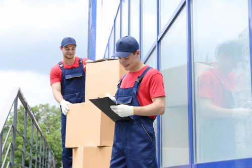 Professional movers assisting with storage during Dulwich home move